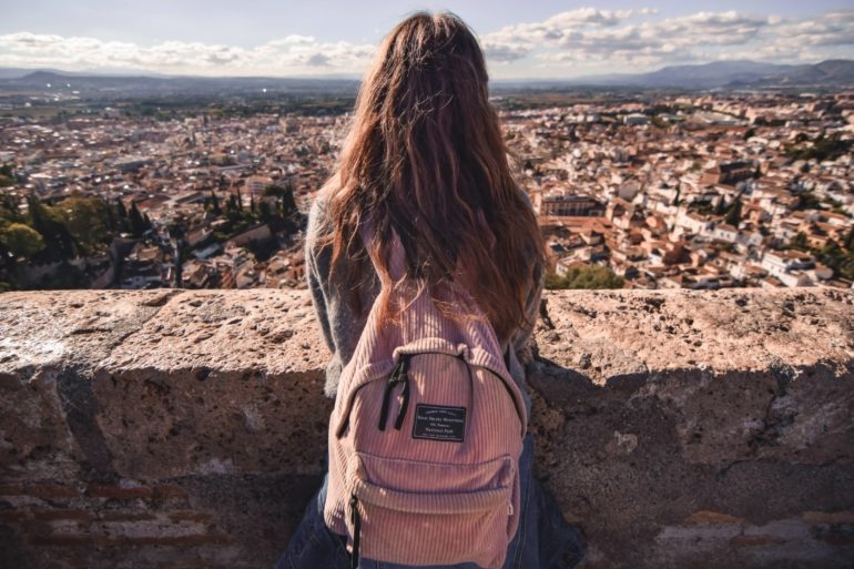 girl standing overlooking city