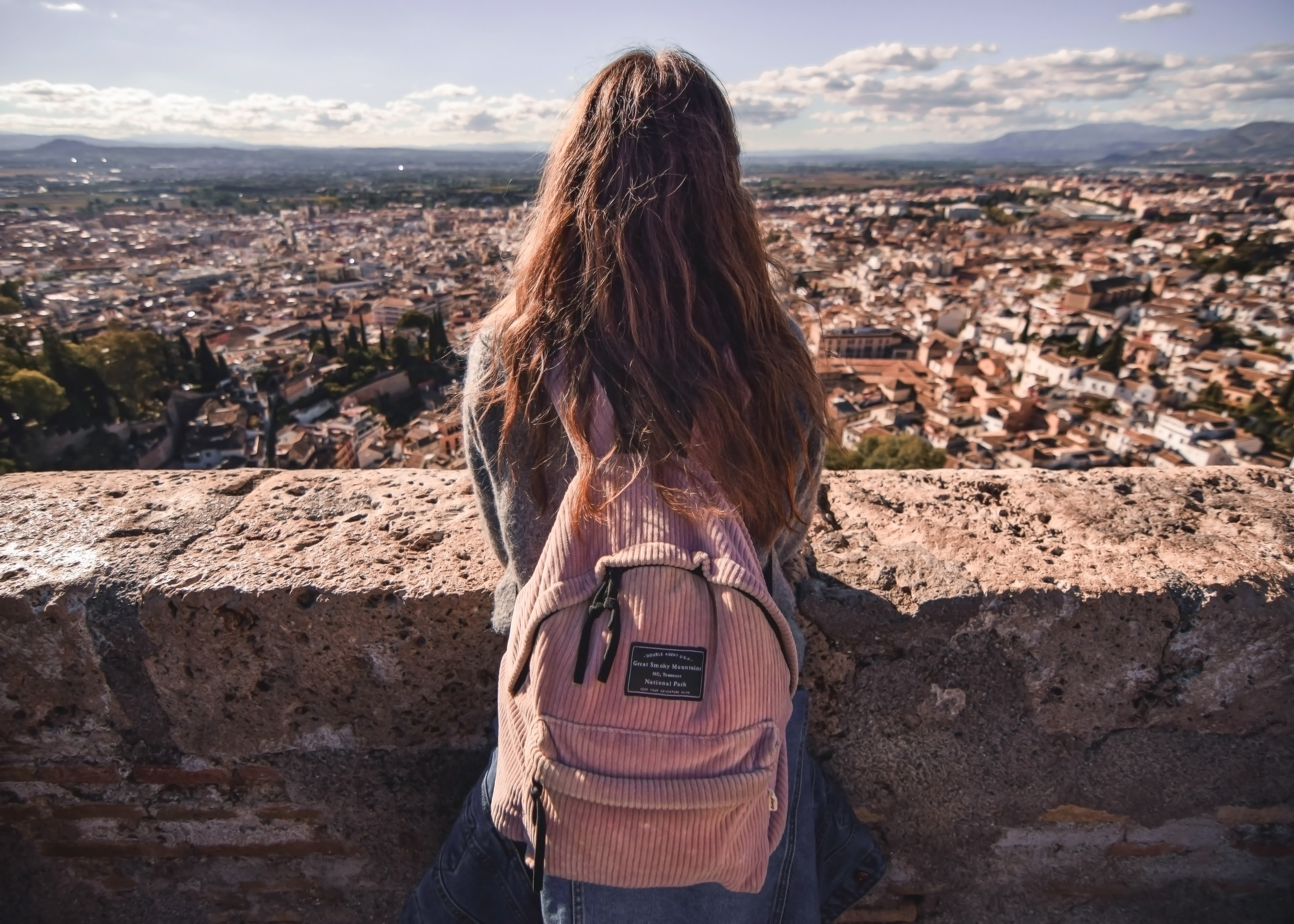 girl standing overlooking city