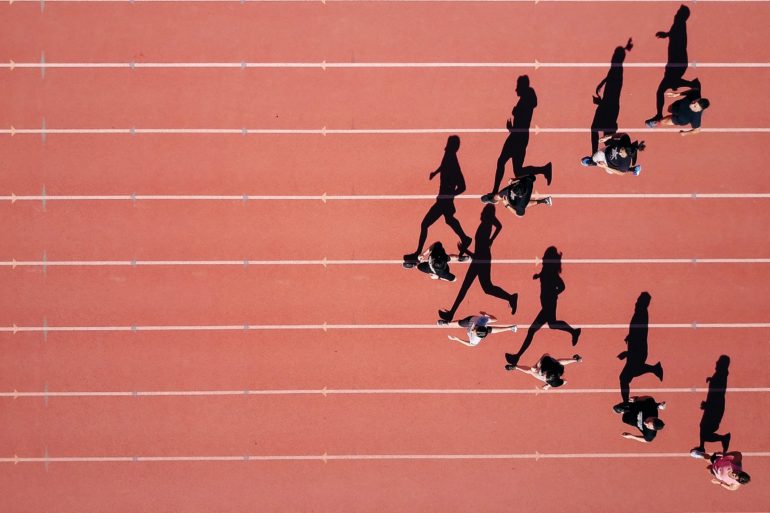 group running on track top-down view